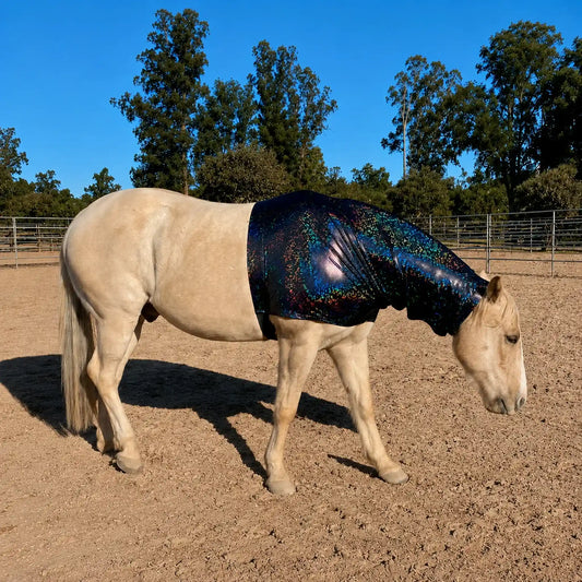 Horse wearing a shiny hologram black faceless hood sleazy in an outdoor setting with trees and a clear sky.