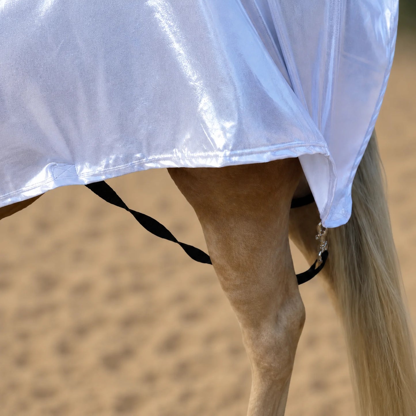 Shiny metallic silver faceless full body sleazy on a horse with leg straps and metal hardware