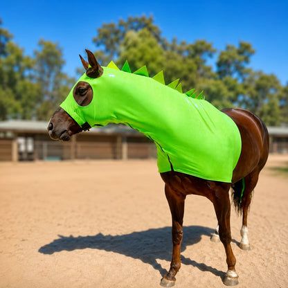 Horse wearing a bright metallic green dragon with spikes costume sleazy with matching tailbag with spiky details outdoors.