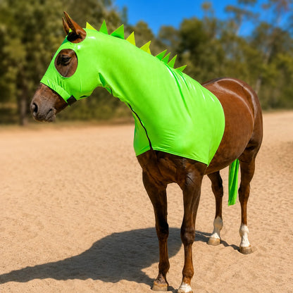 Horse wearing a bright metallic green dragon horse costume sleazy with matching tailbag with spikes outdoors on a sunny day.