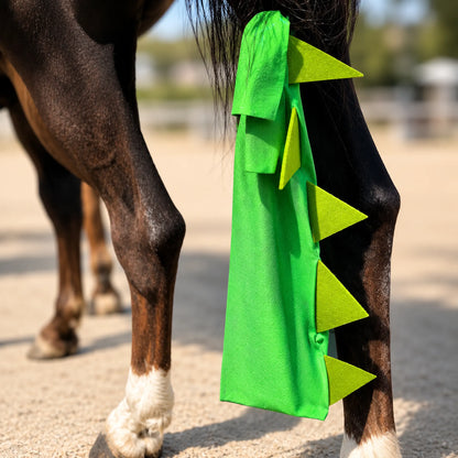 Horse tail with a green dragon tailbag costume sleazy on a blurred outdoor background