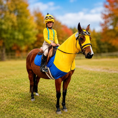 Person riding a horse wearing a Minion costume yellow and blue sleazy in an outdoor setting with trees and grass.