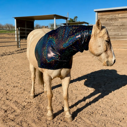 Horse wearing a reflective hologram black faceless horse hood sleazy in an outdoor stable area