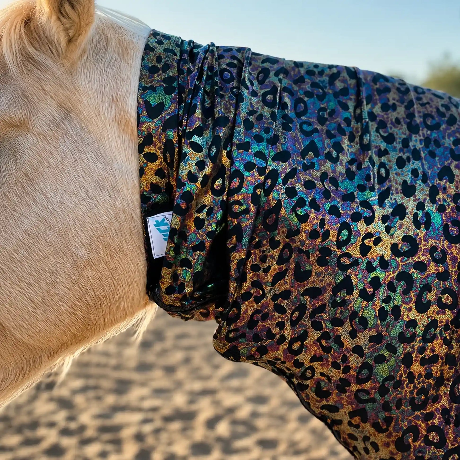 Close-up of a horse wearing a hologram leopard faceless sleazy hood with a blurred background
