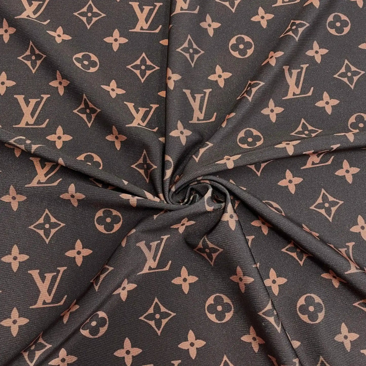 A close-up of a dark brown fabric with a repeating LV pattern, gathered in the center to show the material texture and print.