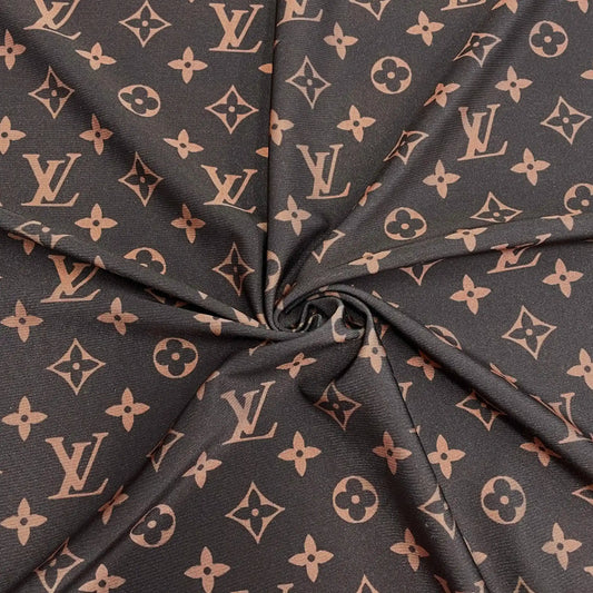 A close-up of a dark brown fabric with a repeating LV pattern, gathered in the center to show the material texture and print.