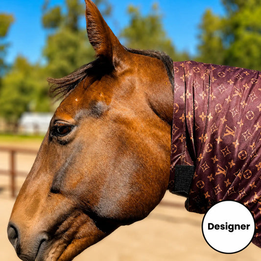 A close-up side view of a brown horse outdoors wearing a LV brown faceless full body sleazy. 