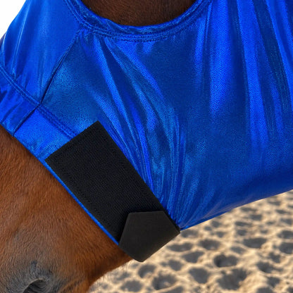 A close-up of a horse wearing a shiny metallic royal blue sleazy hood with a black nose velcro strap, set against a sandy background.