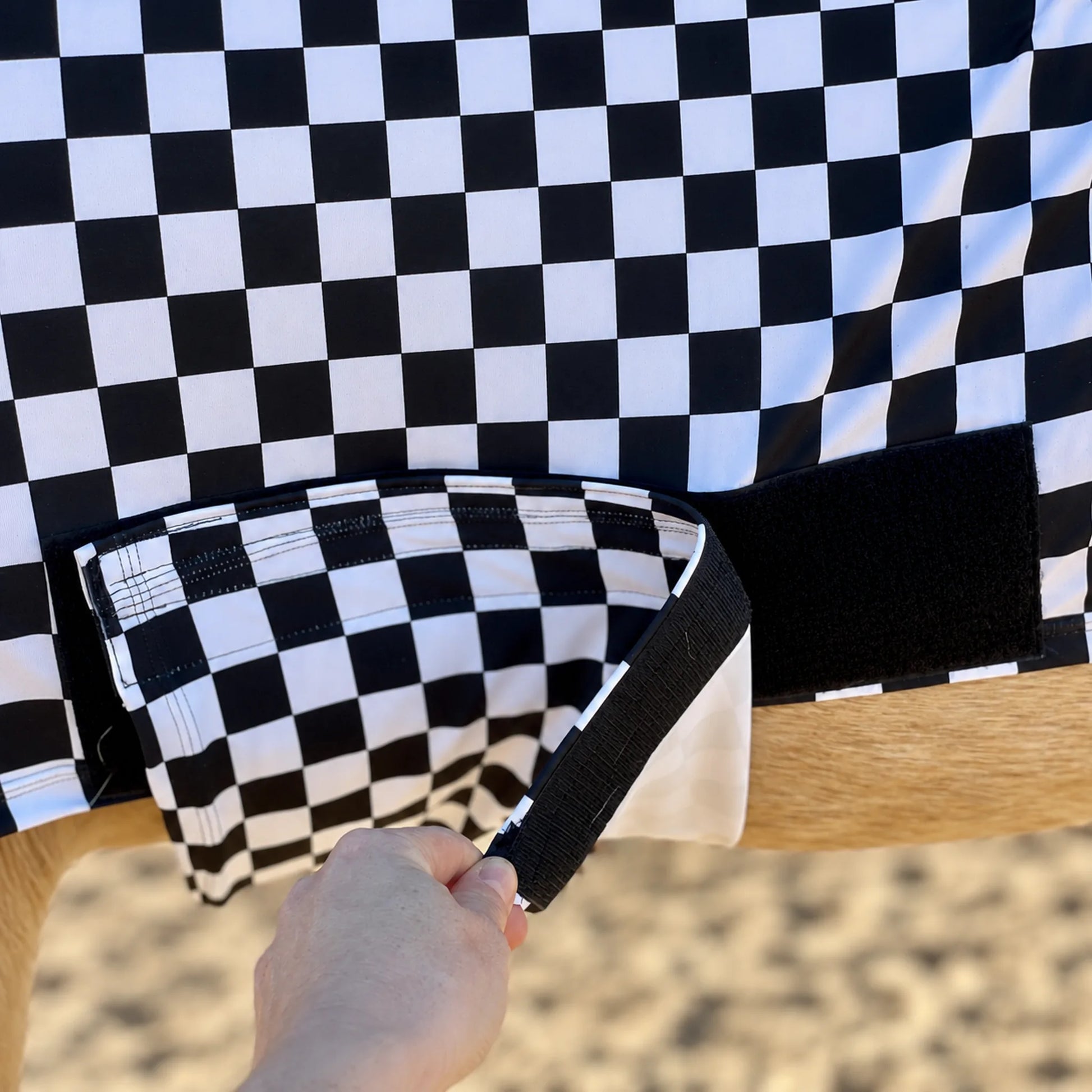 Print checkered black and white full body sleazy horse belly velcro view showing the belly band