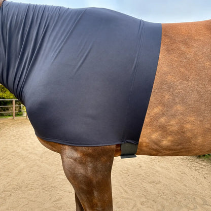 Horse wearing a heavyweight superflex black faceless hood in an outdoor setting
