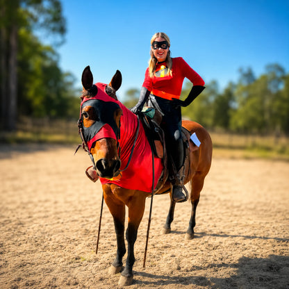 Woman riding a horse wearing an incredibles metallic red costume sleazy in an outdoor setting